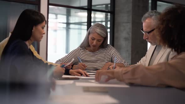 Concentrated businesspeople talking to each other