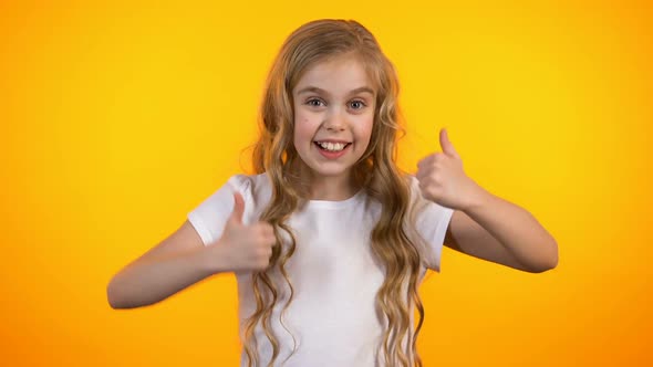 Cute Emotional Schoolgirl Showing Thumbs-Up, Extremely Satisfied Child, Promo