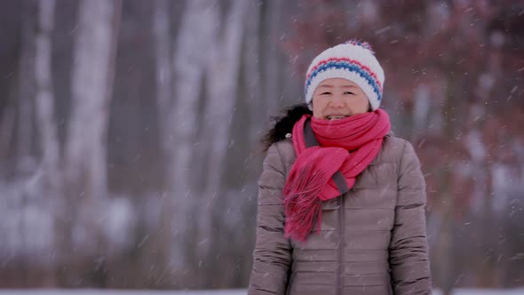 Asian Woman Freezing On Cold Day