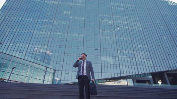 Luxury building and business man talking by phone, cheerful happy.