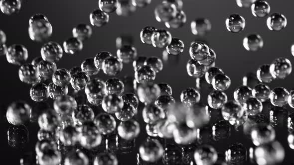 Super Slow Motion Shot of Hydrogel Balls Bouncing on Glass at 1000Fps