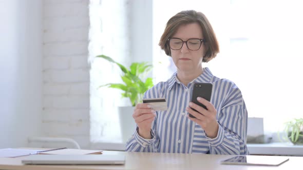 Senior Woman Unable to Make Online Payment on Smartphone