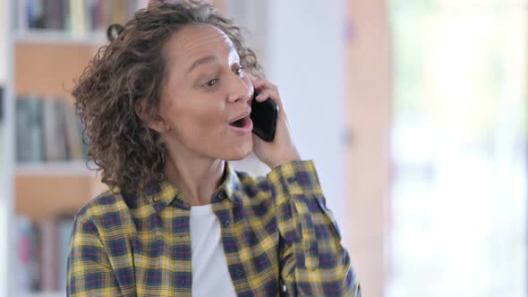 Portrait of Mixed Race Woman Talking on Smartphone