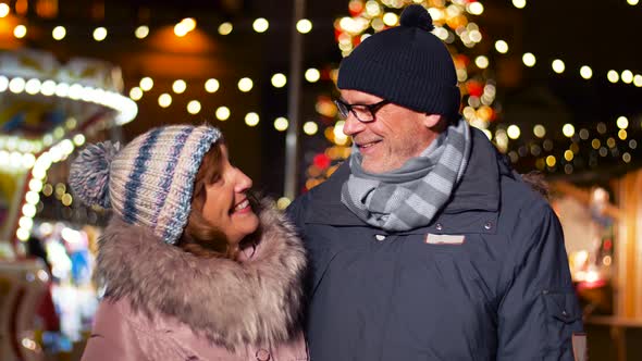 Happy Senior Couple Smiling at Christmas Market 16