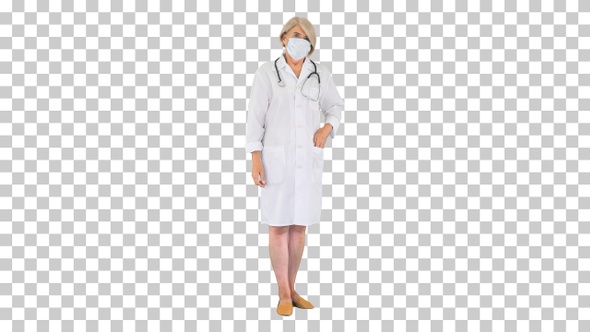 Senior woman doctor putting on medical, Alpha Channel