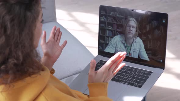 Girl Student Talking with Friend or Teacher Meet Online Video Call on Laptop