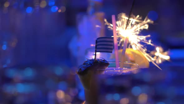 Bar Cocktails with Sparkler and Greek Flag