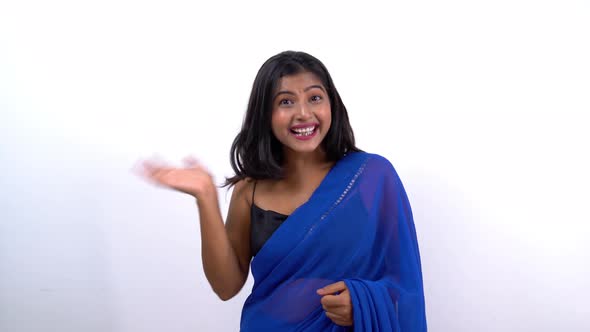 Happy Indian girl waving hand