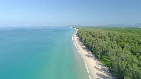 Aerial view Top view of Beautiful tropical sea sandy beach and waves crashing against sand beach