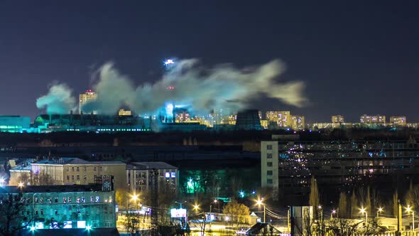 Pipes with Smoke and Residential Apartment Buildings Night Timelapse