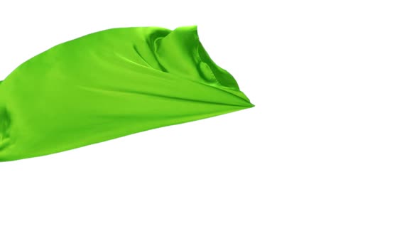 Green fabric flowing on white background, Slow Motion