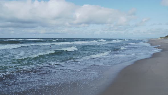 Sea Surf on Curonian Spit. Big Waves on Sandy Beach. Kaliningrad Oblast, Russia.