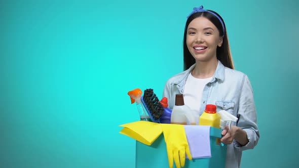 Smiling Housewife Holding Basket With Detergents, Cleaning Service Worker