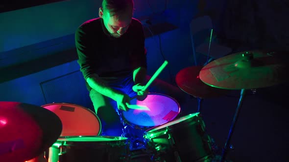 Drummer Playing Drums in the Nightclub