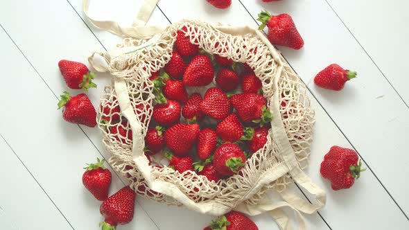 Fresh Strawberries in Eco-friendly Package on White Wooden Background. Vegetarian Organic Meal