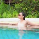 Young asian woman enjoy around outdoor swimming pool for leisure - VideoHive Item for Sale