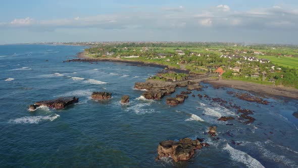 Aerial Footage of Black Volcanic Beach Green Rice Terraces