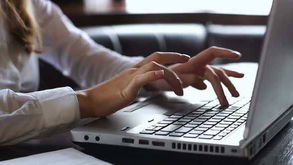 Female Lawyer Typing on Laptop, Checking Data in Agreement, Sending E-Mail