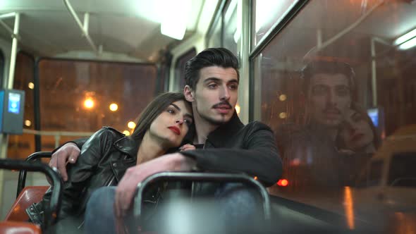 Couple sitting in a train  alt