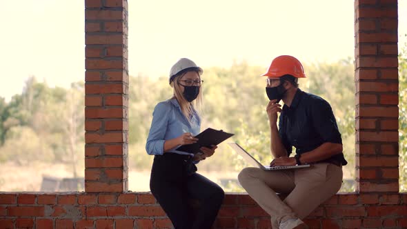 Two Engineer In Helmet Inspecting Building. Builder Contractor Specialist Read Home Plan Scheme.