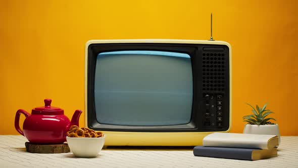 Closeup of Old Retro Television on Orange Background