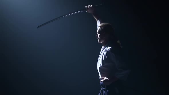 Man Fighting at Aikido Training with Japanese Sword Katana in Martial Arts School. Healthy Lifestyle