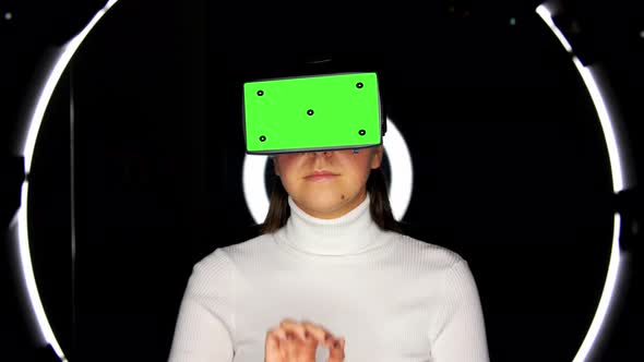 Woman in Vr Glasses Over Illumination on Black