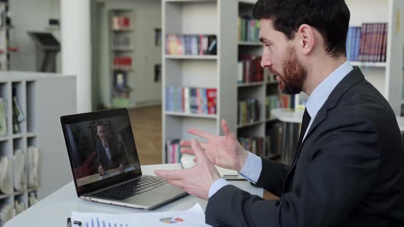 Two Business Colleagues are Negotiating By Video Conference