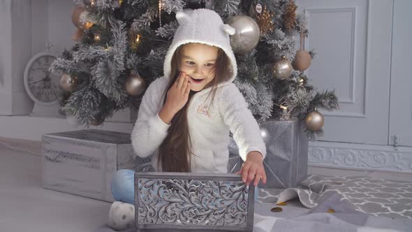 Young Girl Opening a Christmas Present on a Christmas Morning