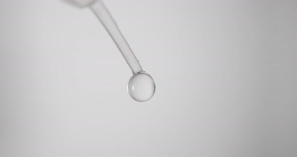 Droplets Of Extraction Buffer From Pipette For COVID-19 Rapid Test. - close up