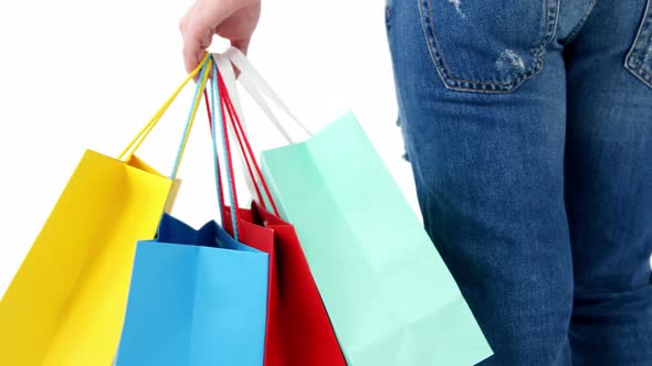 Woman standing with shopping bag