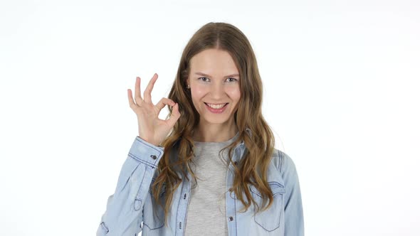 Okay Sign by Beautiful Woman on White Background