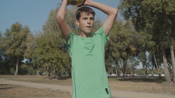 Soccer Player Taking Correct Throw-in During Game