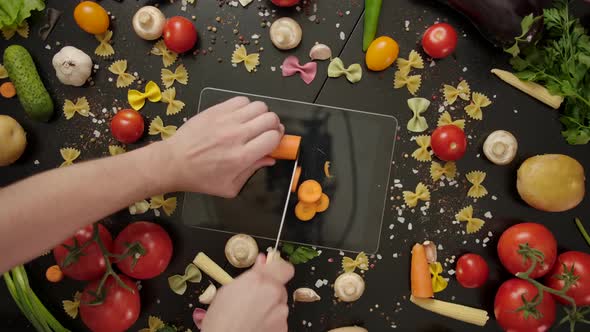 Crazy Cook Cutting Carrot on Digital Tablet, Damaging the Device.