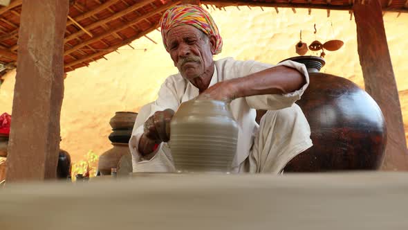 Potter at Work Makes Ceramic Dishes