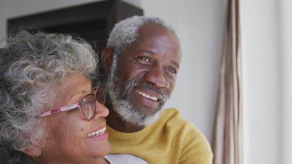 A senior african american couple spending time together at home in love social distancing in quarant