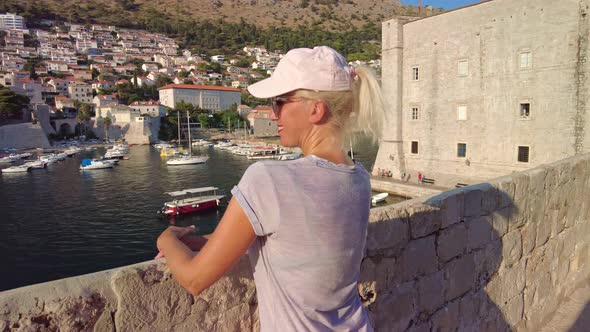 Woman in Old Medieval Port in Croatia