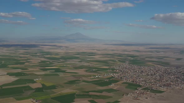 Plains And Mountain And Town Aerial View