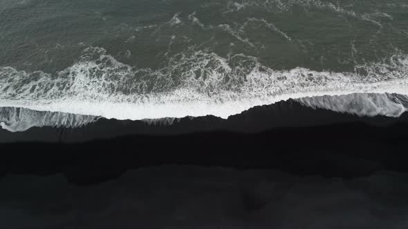 Drone Shot Of White Tide On Black Sand Beach