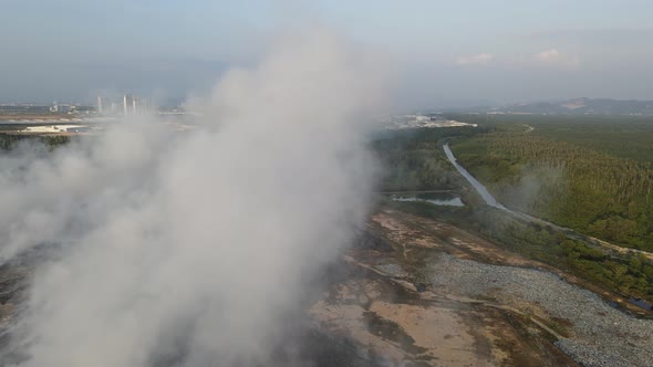 Aerial view fire smoke release to sky at garbage dump