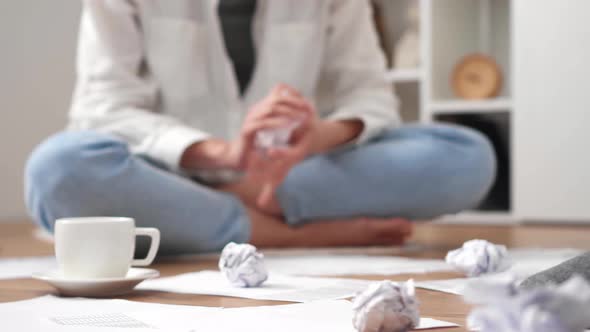 Girl Worker Throws Crumpled Paper In The Form Of A Ball. A Paper Ball Flies Into The Camera