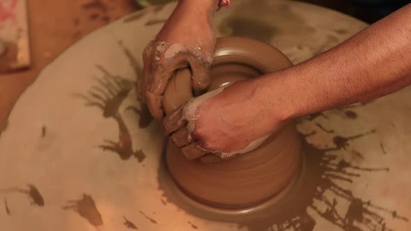 Potter at Work Makes Ceramic Dishes