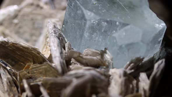 A detail shot of an aquamarine crystal showing the emergence from the matrix of muscovite. Sample fr
