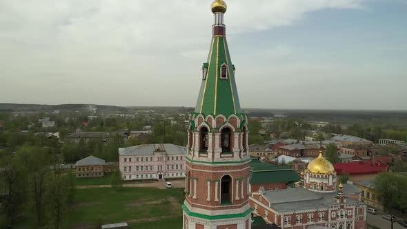 Old Church Tower in Small Town on Cloudy Day