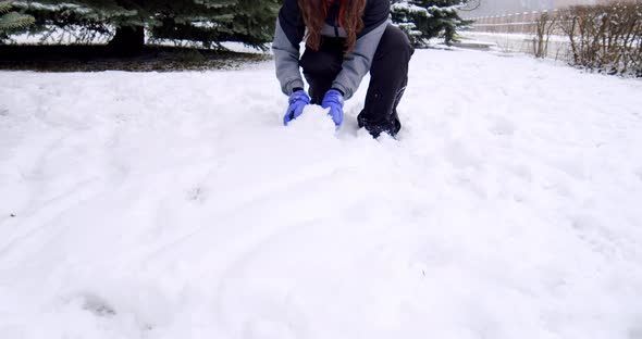 Cheerful Children Play Snowballs on the Street Run and Throw Snowballs