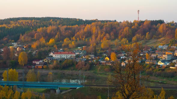 Sunset over the autumn village, time-lapse