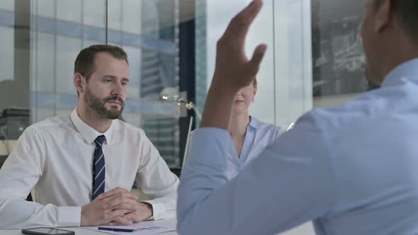 Rear Back View of Guy Having Argument with Executive Business People