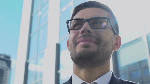 Excited Young Businessman Looking Around Street, Happy With Successful Startup