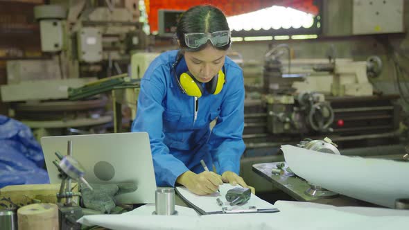 Asian female Professional engineering wearing uniform and safety goggles