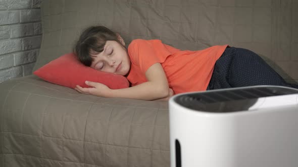 Child Sleeping By Purifier